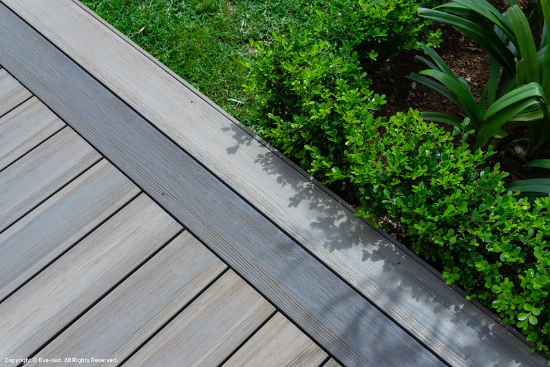Close-up of Eva-Last deck boards and contrasting border beside planting